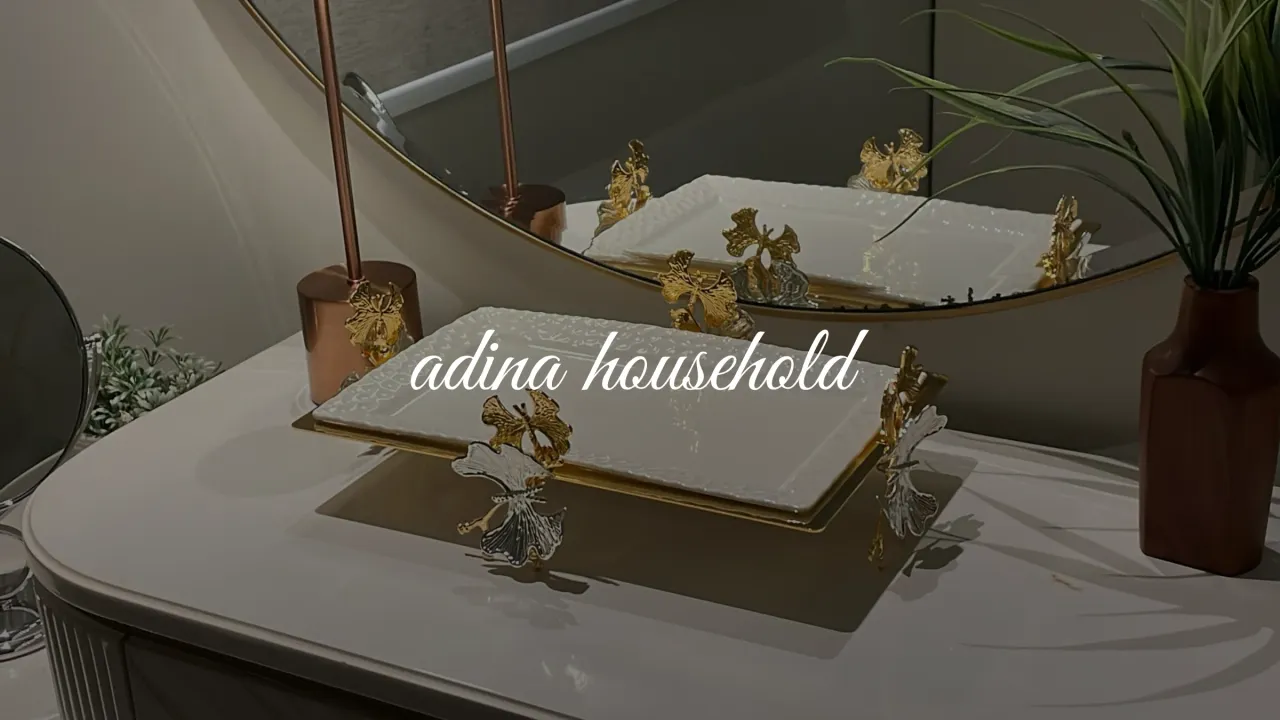 Adina Household, the script wordmark over a styled tabletop
